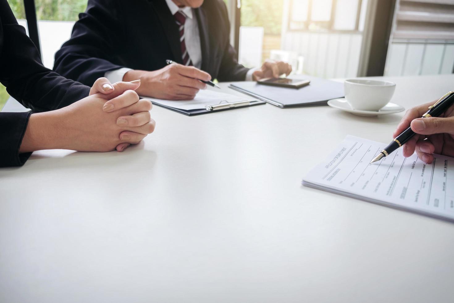 Close-up of professionals in a meeting photo