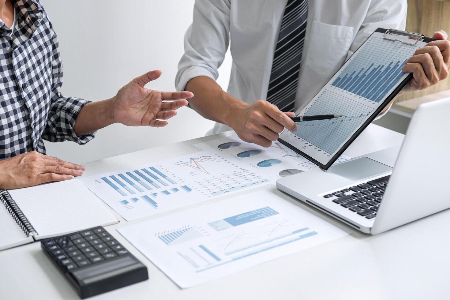 Two coworkers discussing a report photo