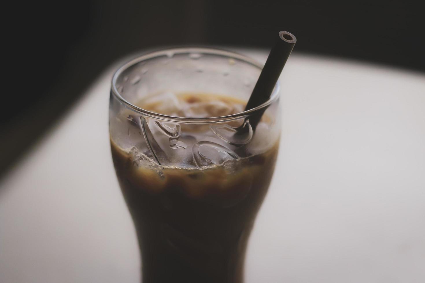 Iced coffee with straw photo