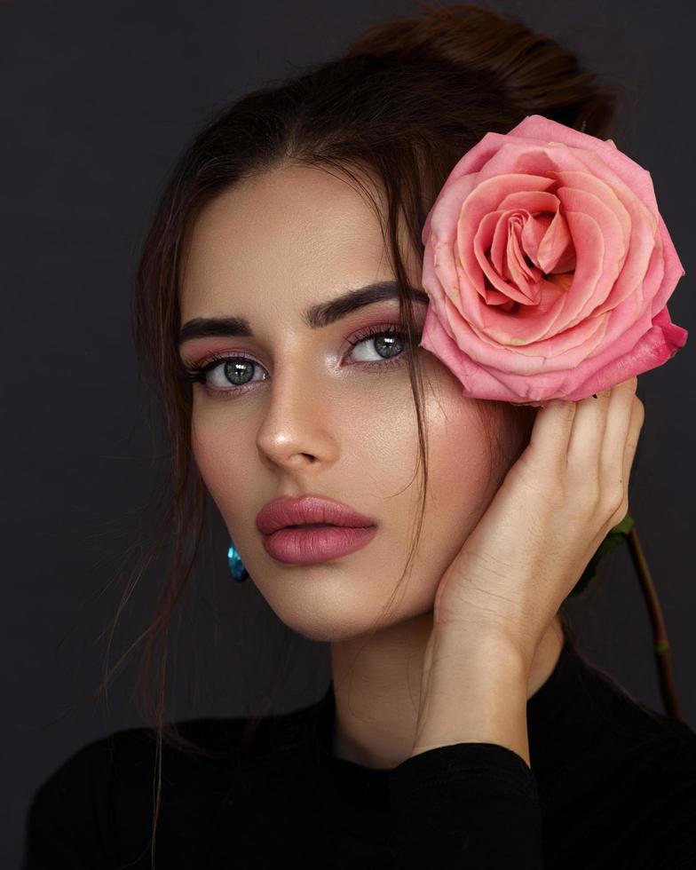 Young girl with a rose photo