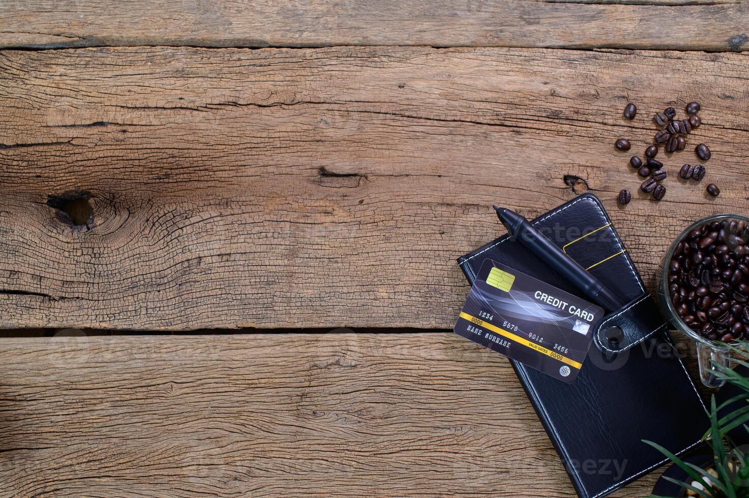 Credit card with book and coffee beans photo