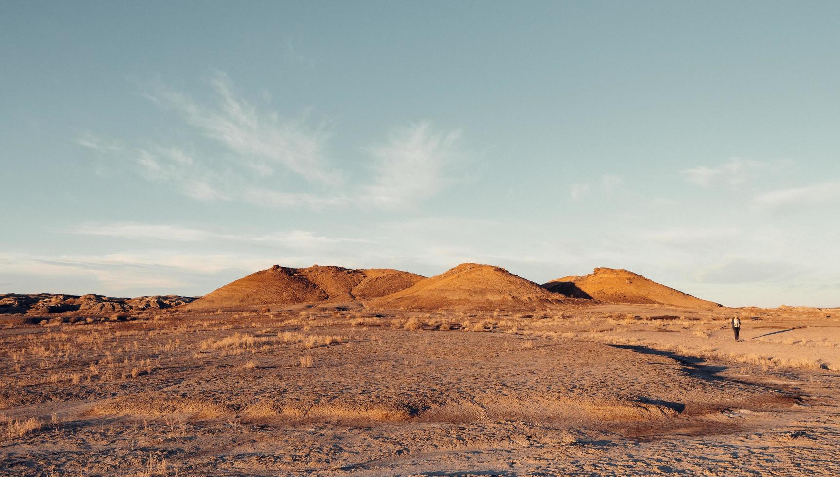 Golden hills in desert photo