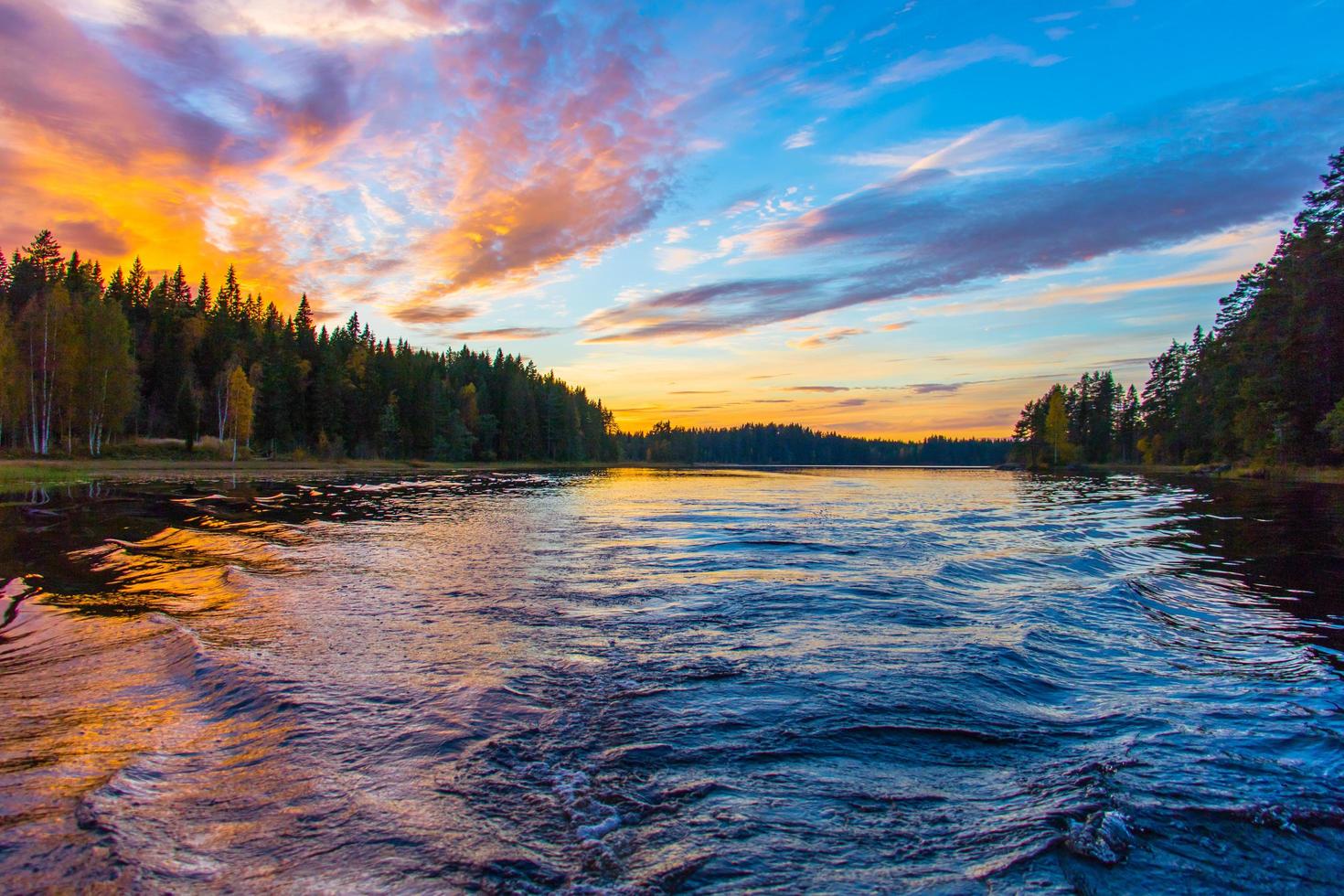 Body of water under blue sky photo