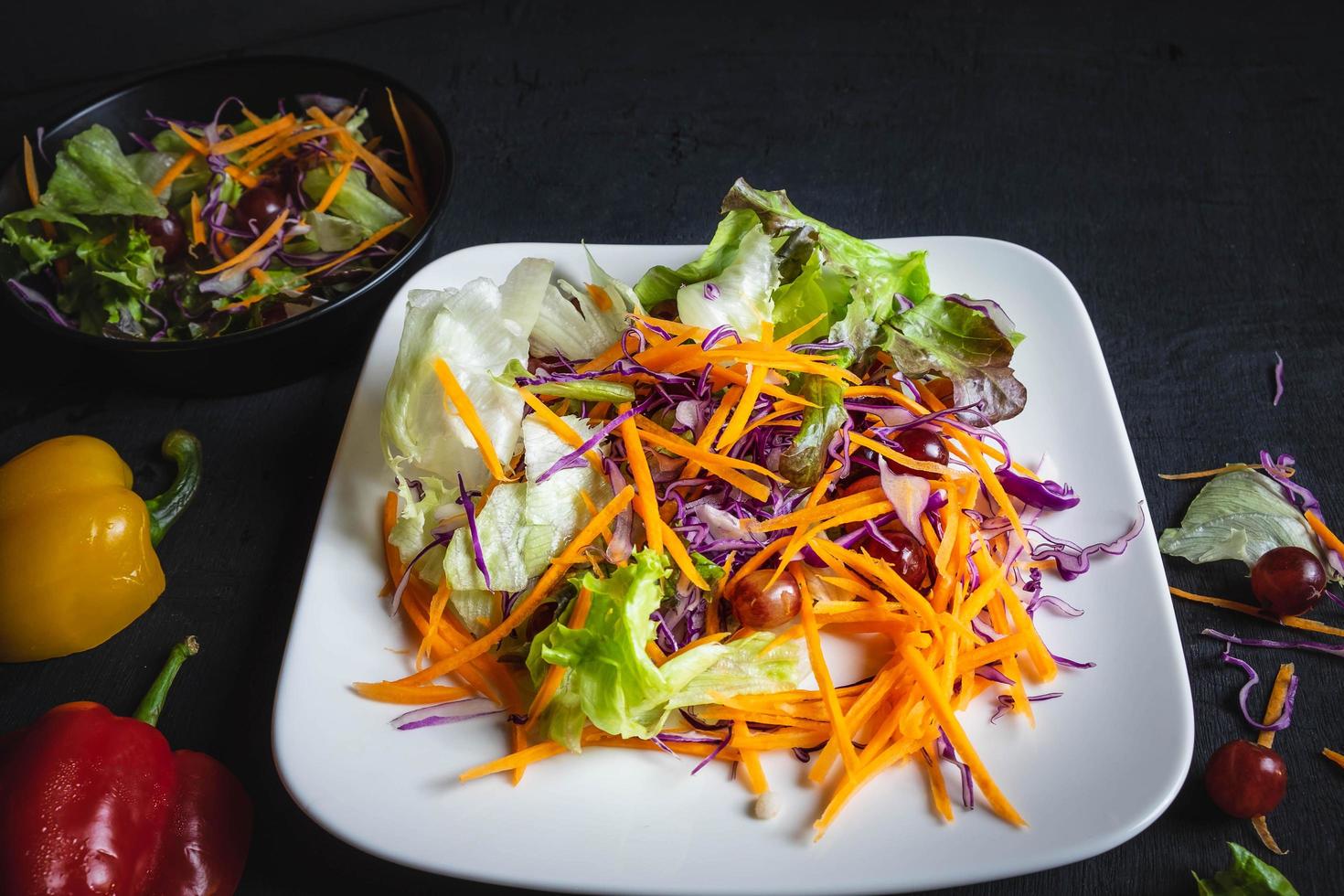 Vegetable salad on black backdrop photo