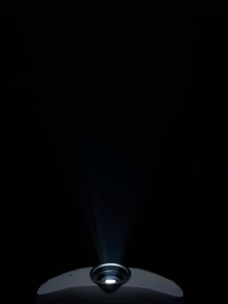 Projector on black background photo