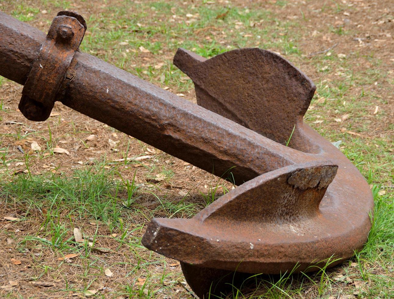 Old anchor on the ground photo