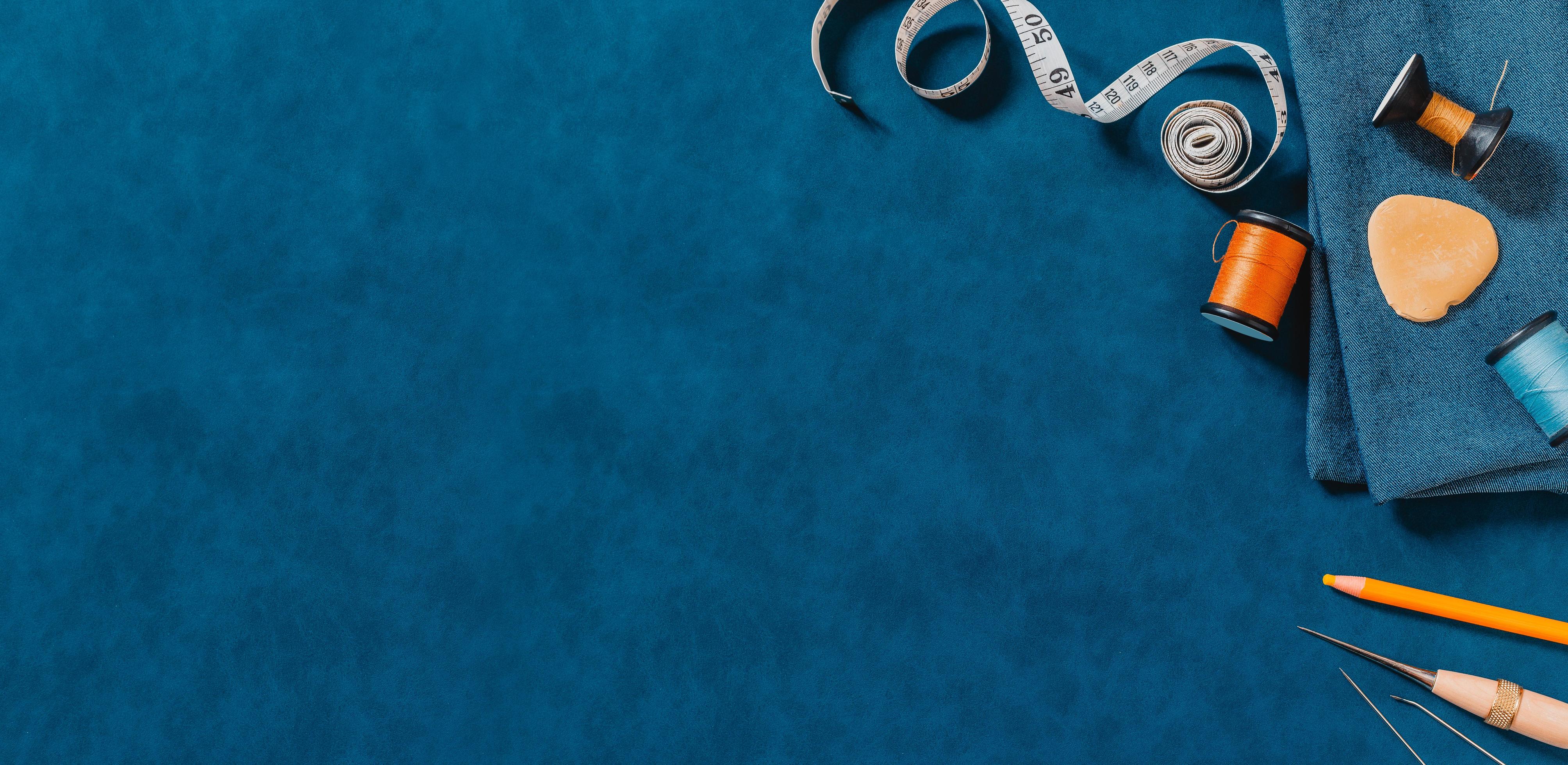 blue-textured-background-with-sewing-tools-1313515-stock-photo-at-vecteezy