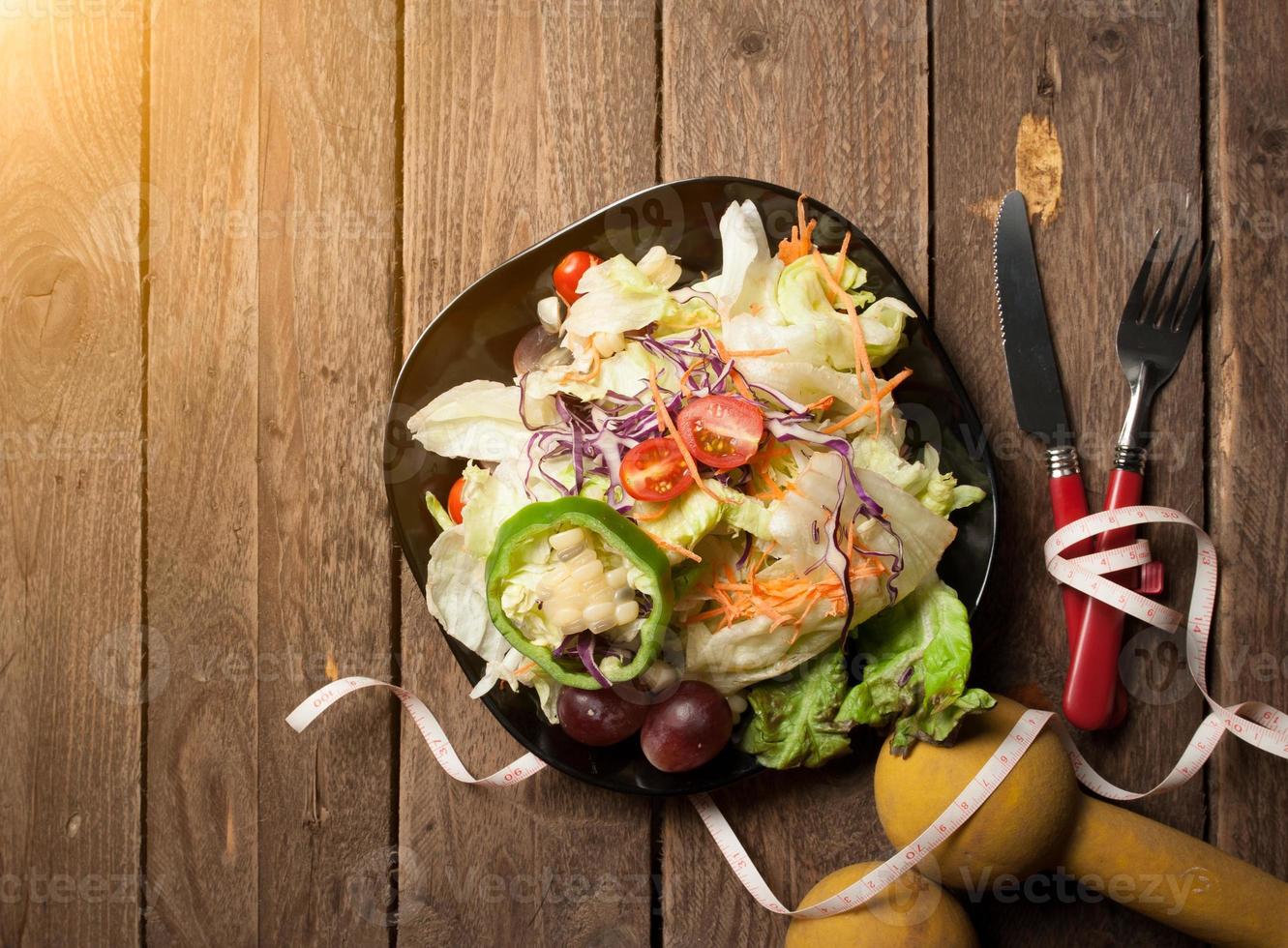Dumbells Tape Measure And Healthy Food Salad On Wooden Backgrou 1314902 Stock Photo At Vecteezy