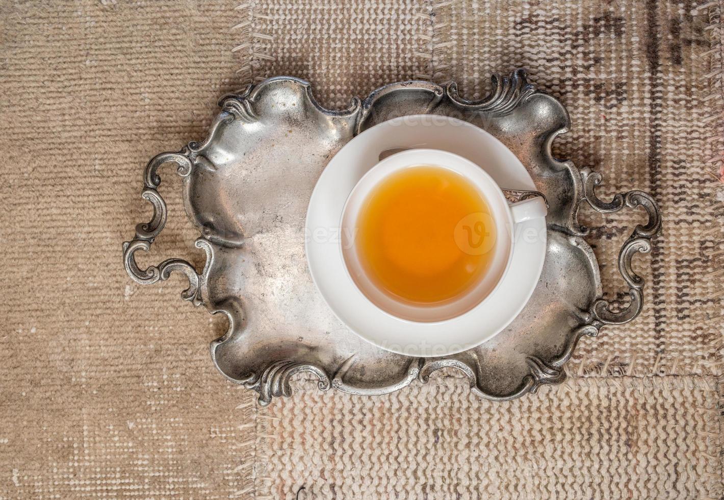 Closeup of cup of tea on vintage textile background 1315577 Stock Photo