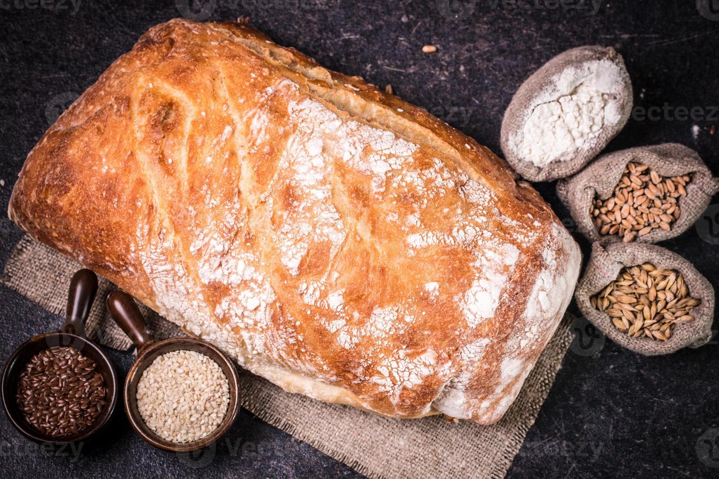 Fresh bread on wooden table photo