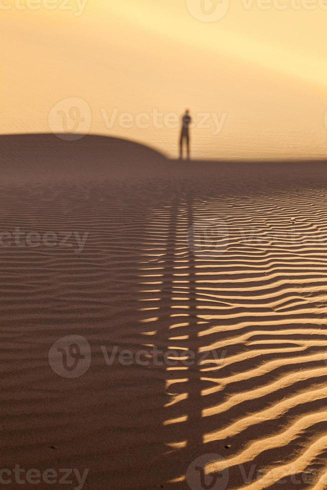 shadow of a man in the desert photo