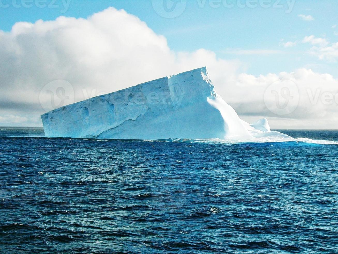Sun shining on iceberg photo