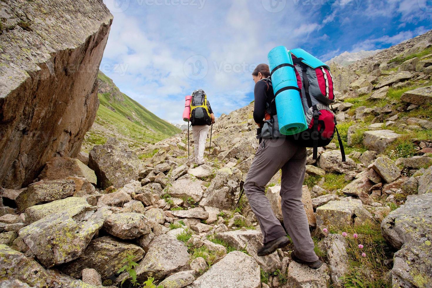 Hiker tecking in Caucasus mountains photo