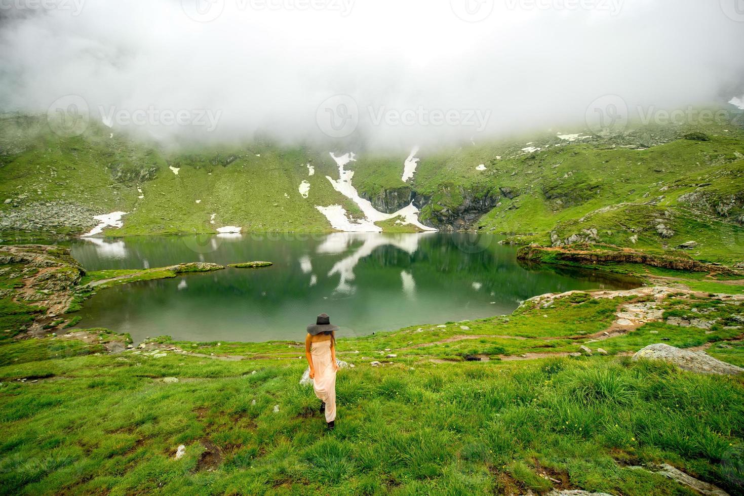 Woman on the mountain lake photo
