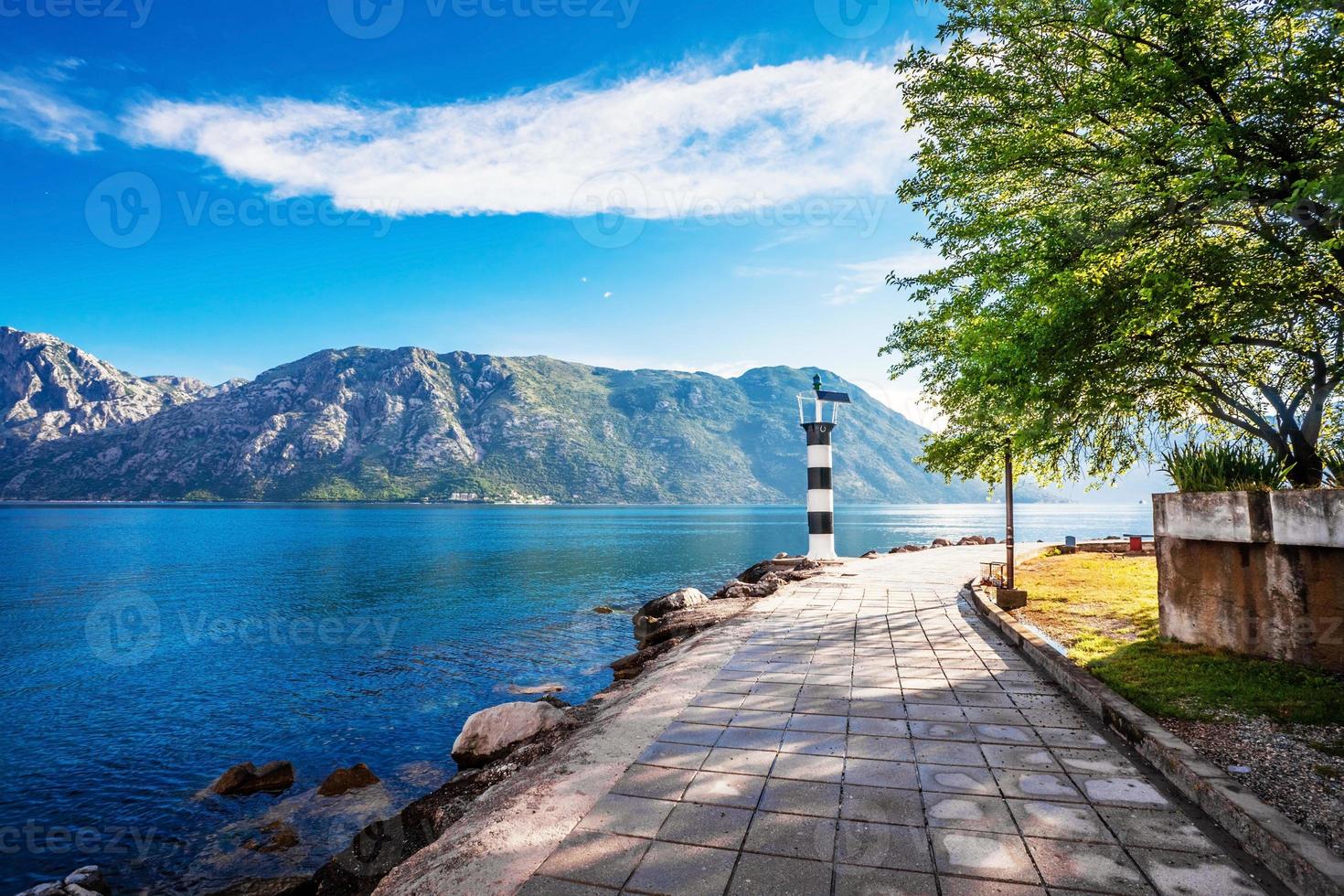 seafront with sea and mountain photo