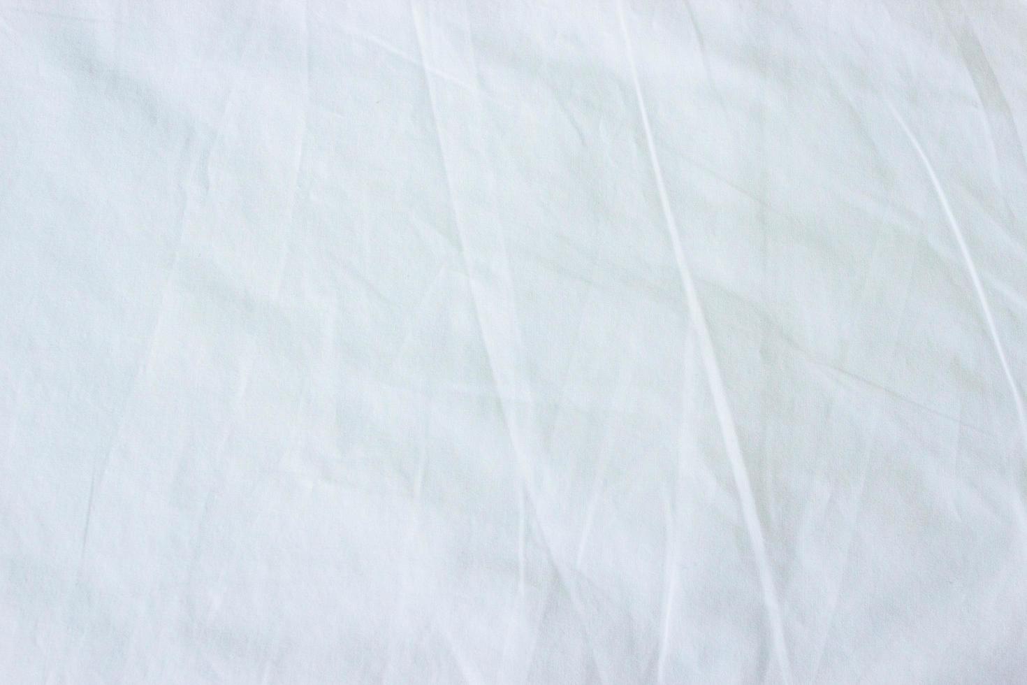 Top view of white fabric bed sheet  photo