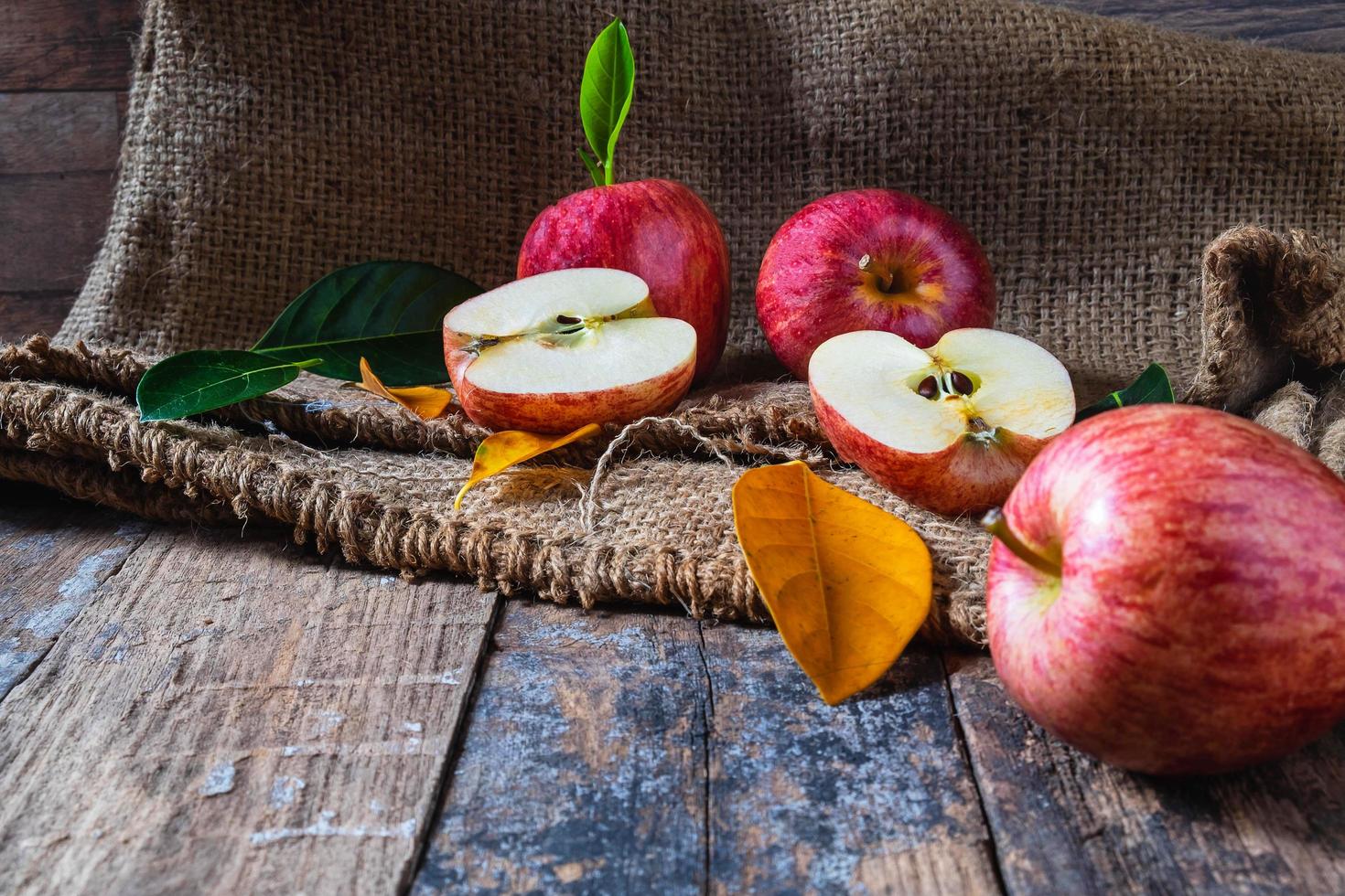 Red apples on a wooden table photo
