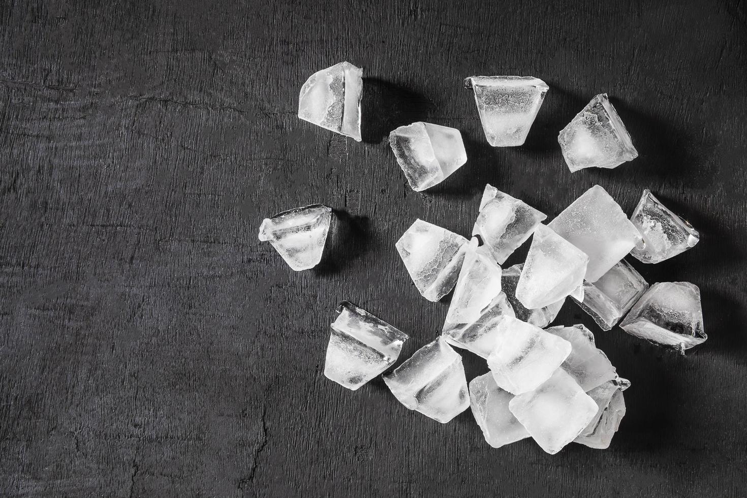 Ice cubes on black background photo