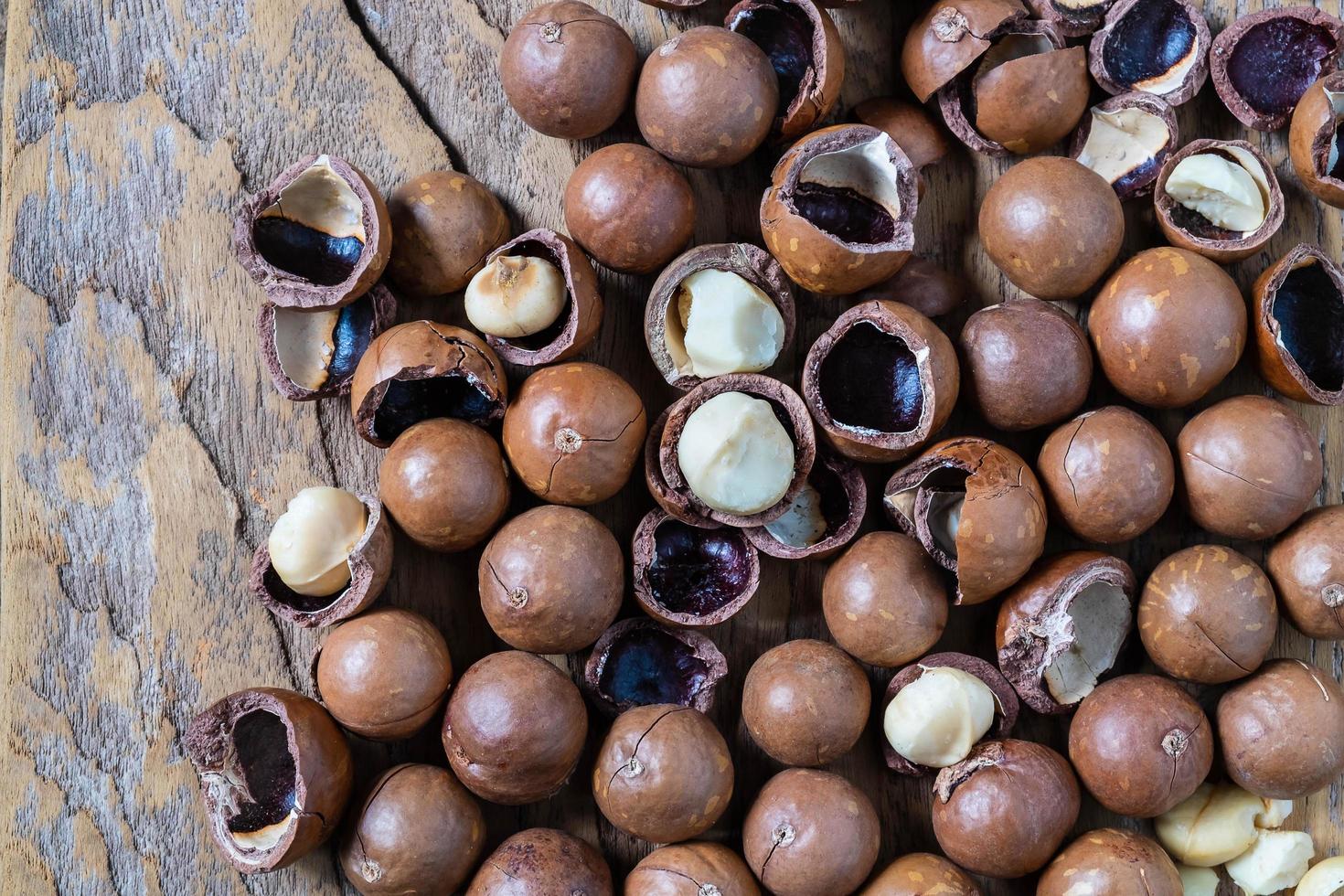 Macadamia nuts with shells photo