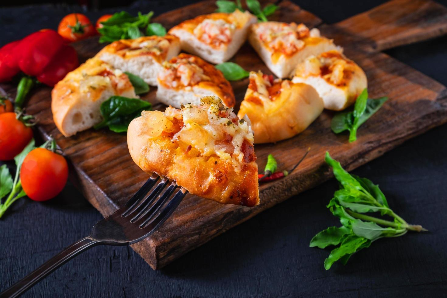 Hot pizza on wooden tray photo