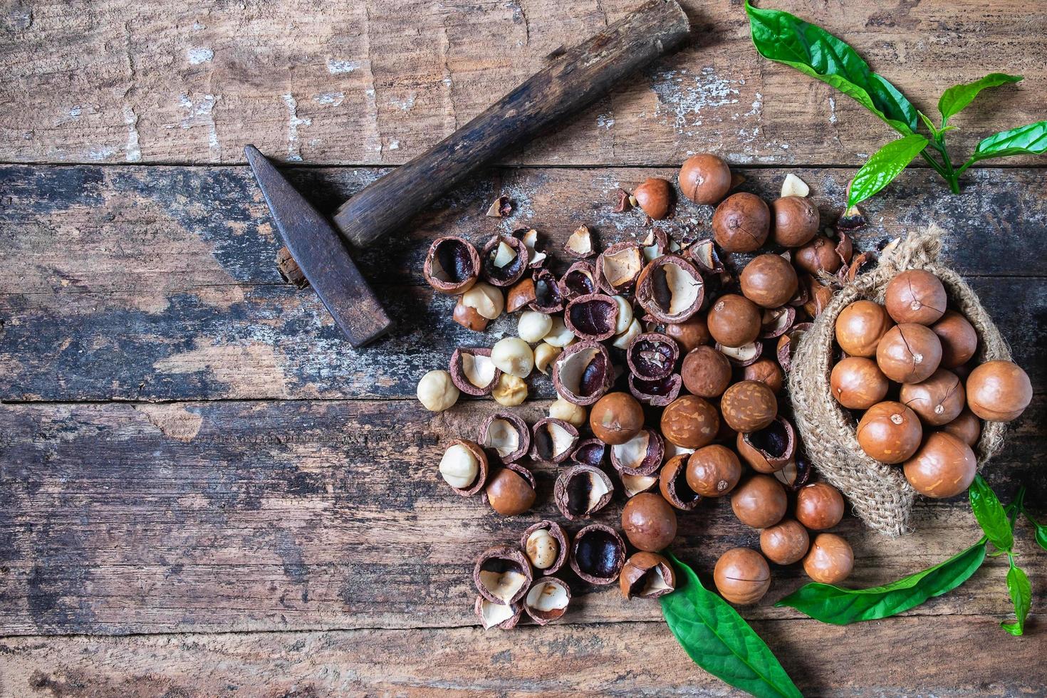 Macadamia nuts on a wooden table photo