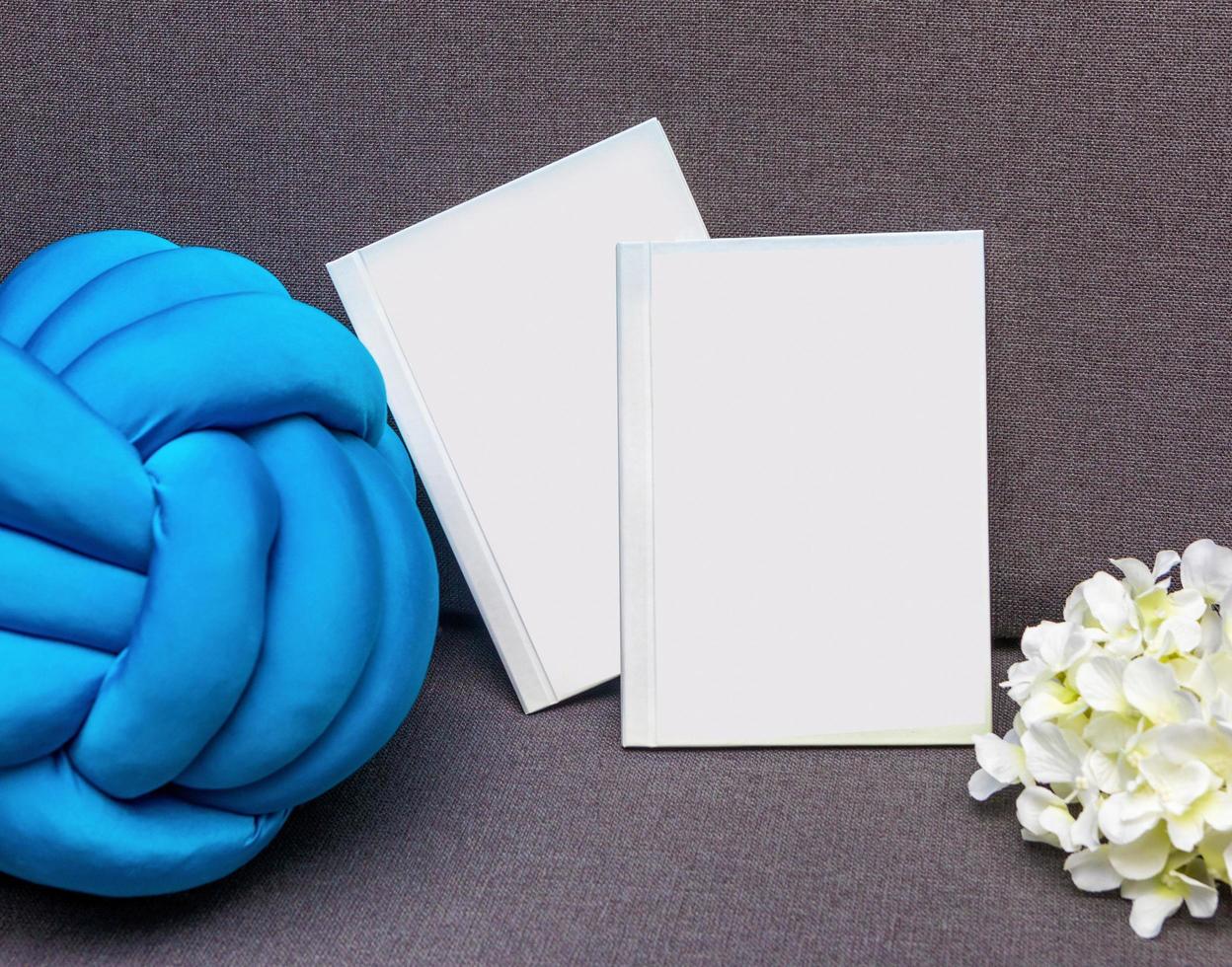 White postcard book with flower photo