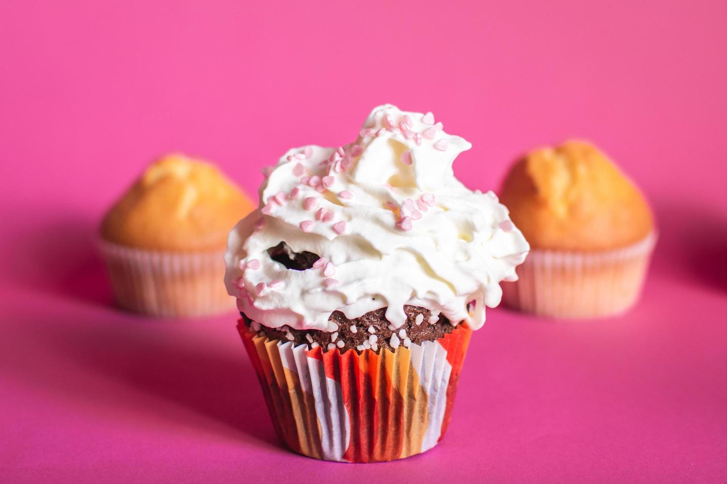 Chocolate cupcake with cream photo