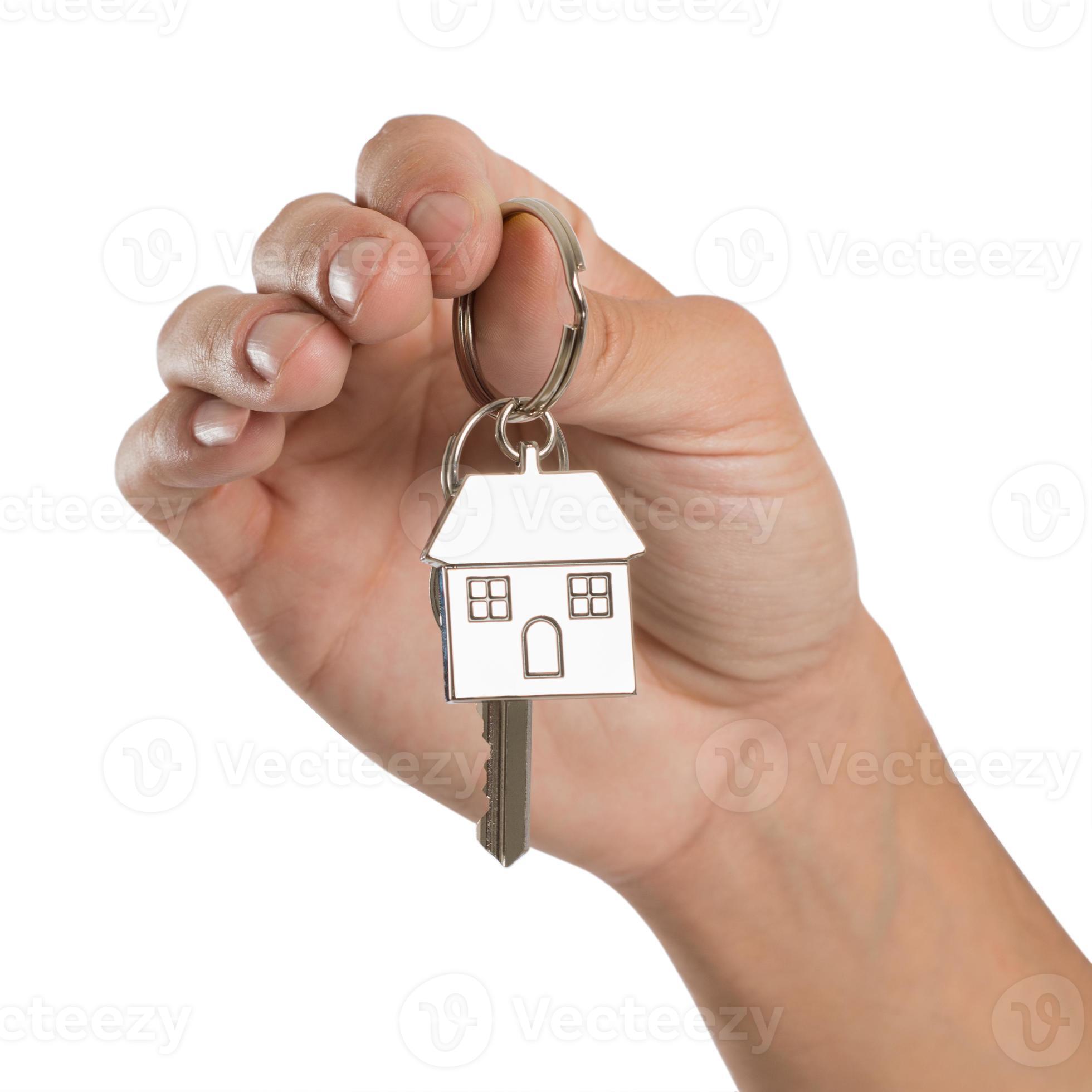 mano sosteniendo la llave de la casa foto