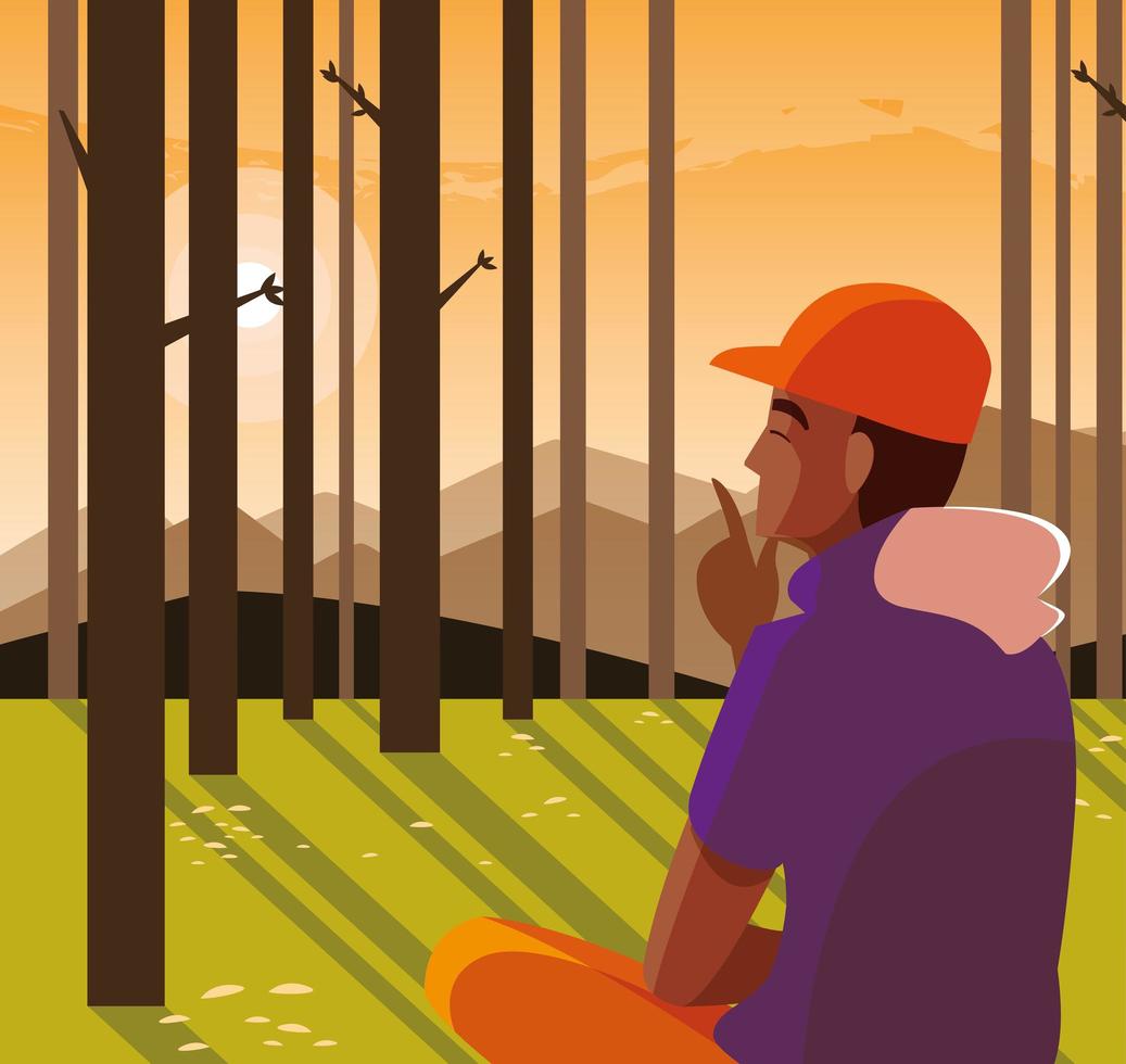 Hombre afro sentado observando el paisaje forestal vector