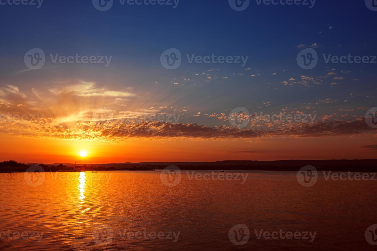 Colourful sunset over lake photo