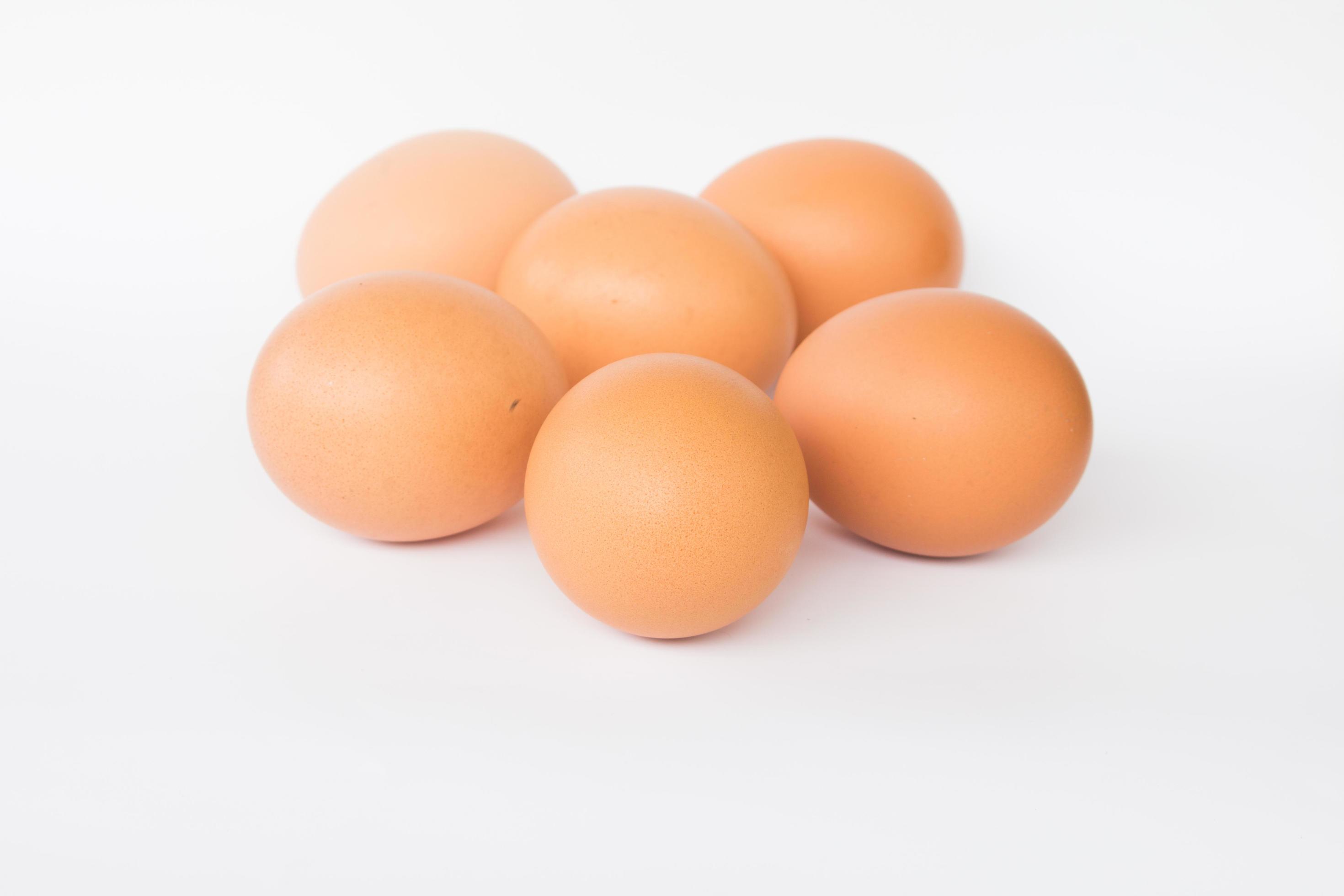 Fresh eggs on a white background 1343646 Stock Photo at Vecteezy