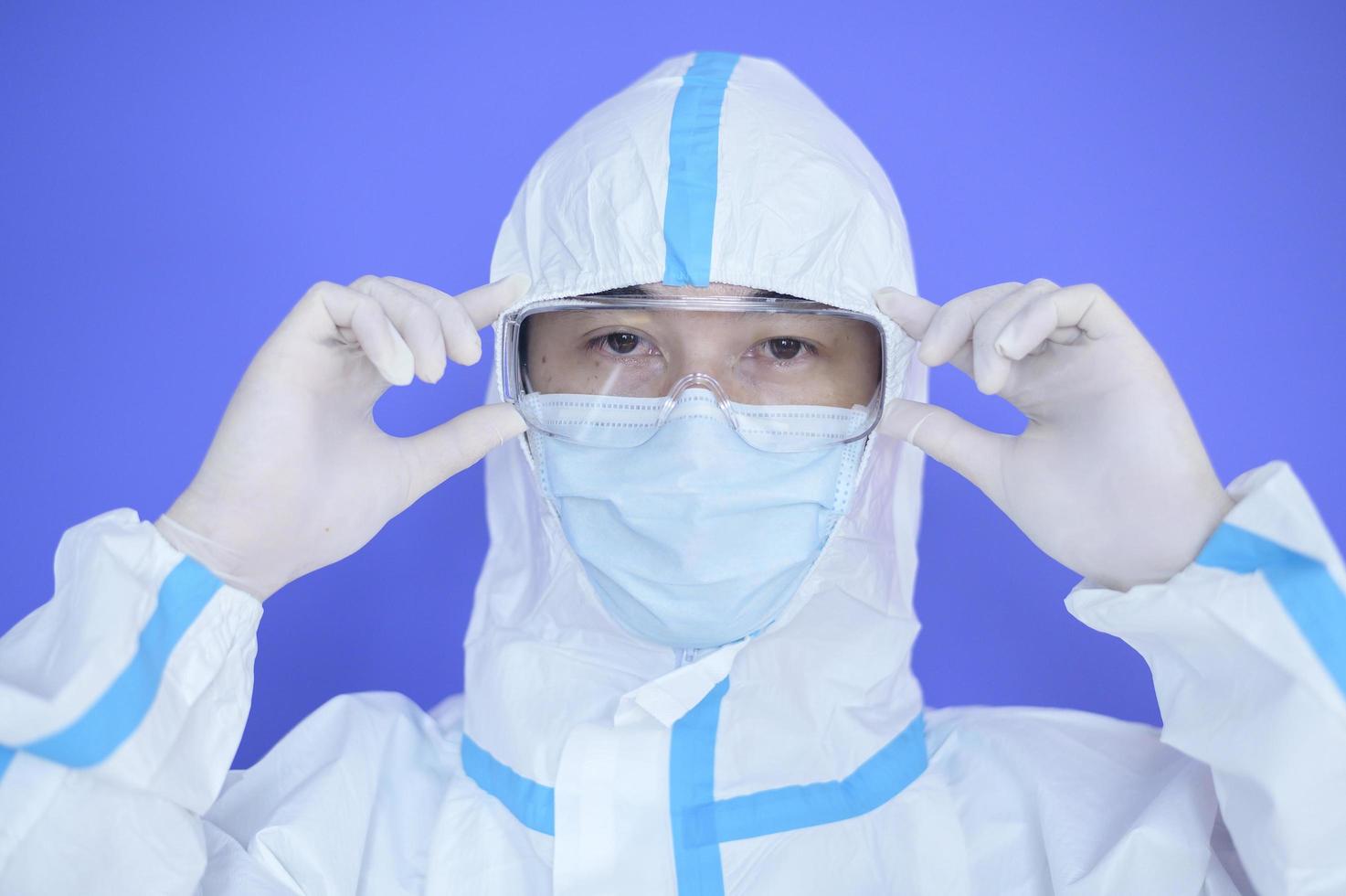 Asian man wearing PPE suit photo