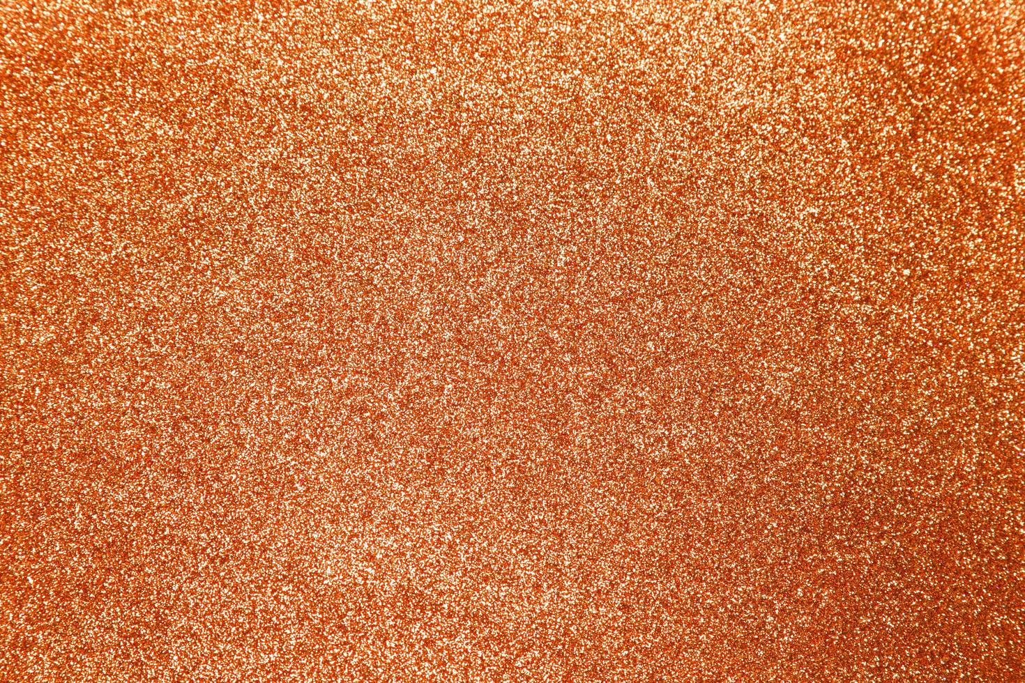 Orange glitter shiny texture background  photo