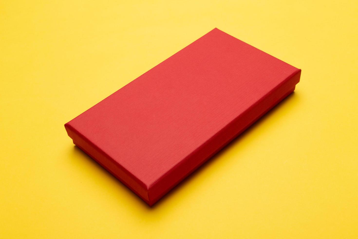 Red box isolated on yellow background photo