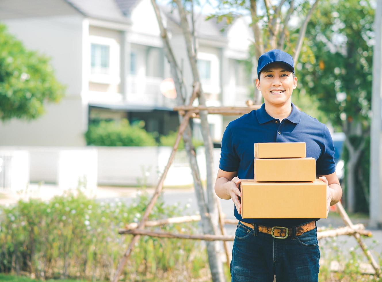 Asian deliver man in blue uniform photo