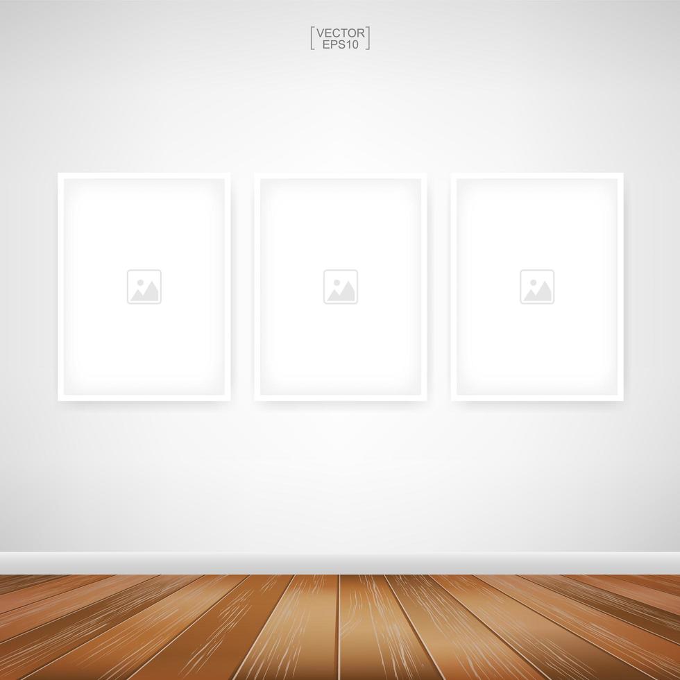 Three empty photo frames on white wall vector