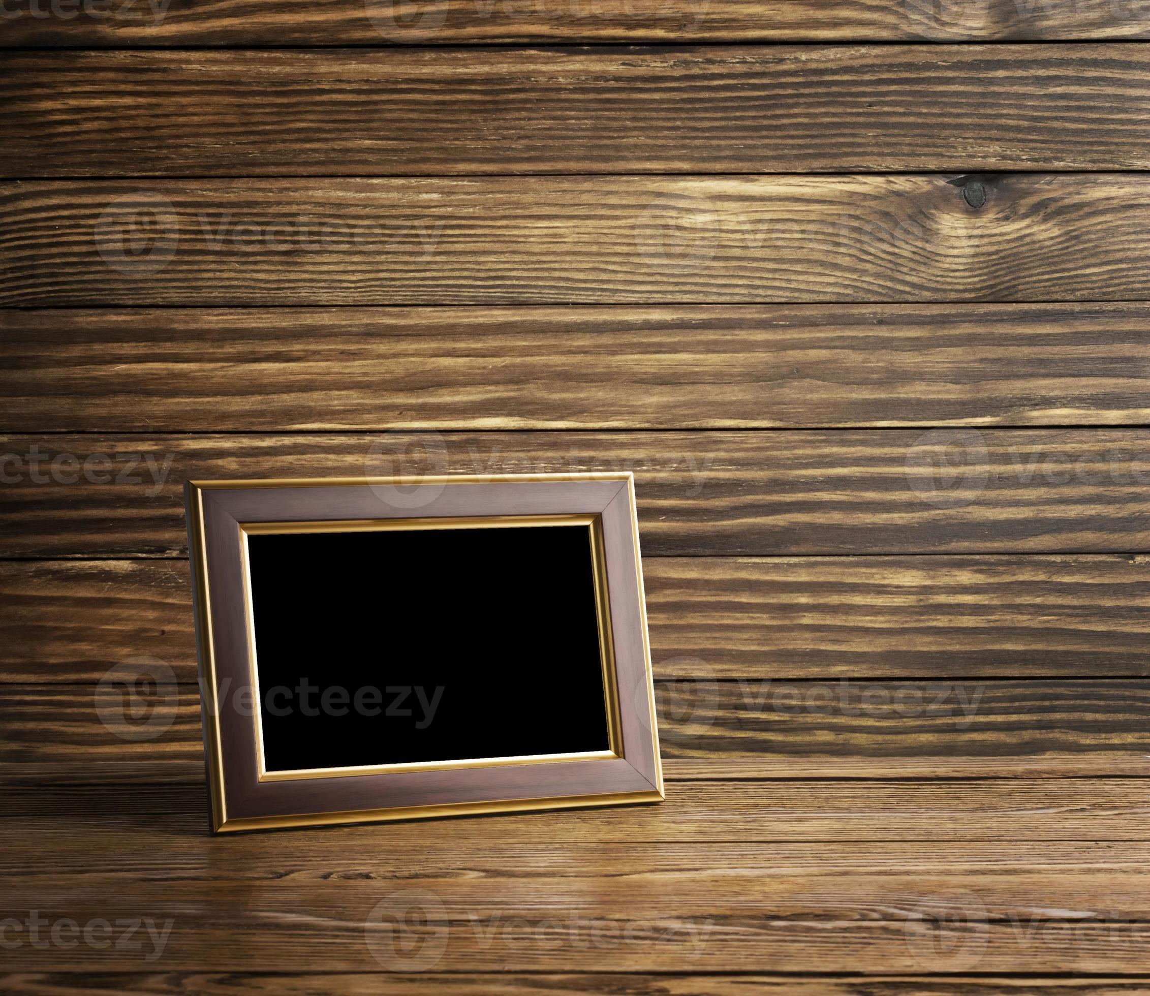 old photo frame on the wooden table 1346005 Stock Photo at Vecteezy