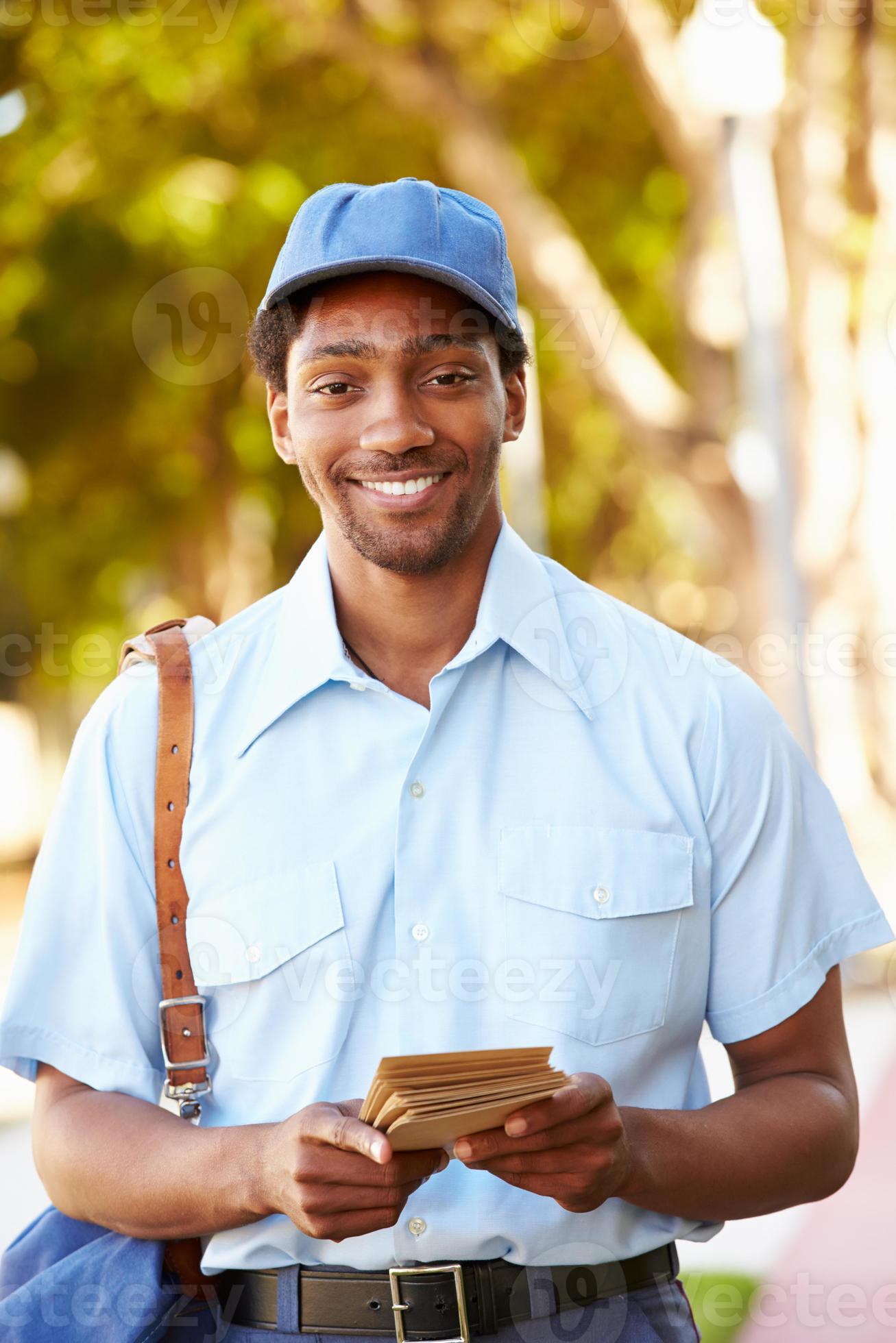 Mailman Walking Along Street Delivering Letters 1351550 Stock Photo at Mailman Walking Along Street Delivering Letters 1351550 Stock Photo at