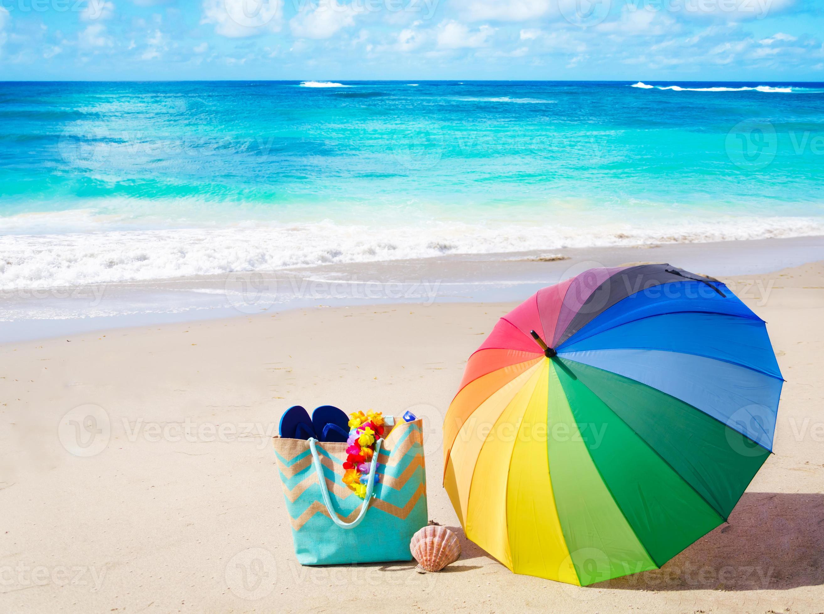 Summer background with rainbow umbrella and beach bag 1354928 Stock Photo  at Vecteezy