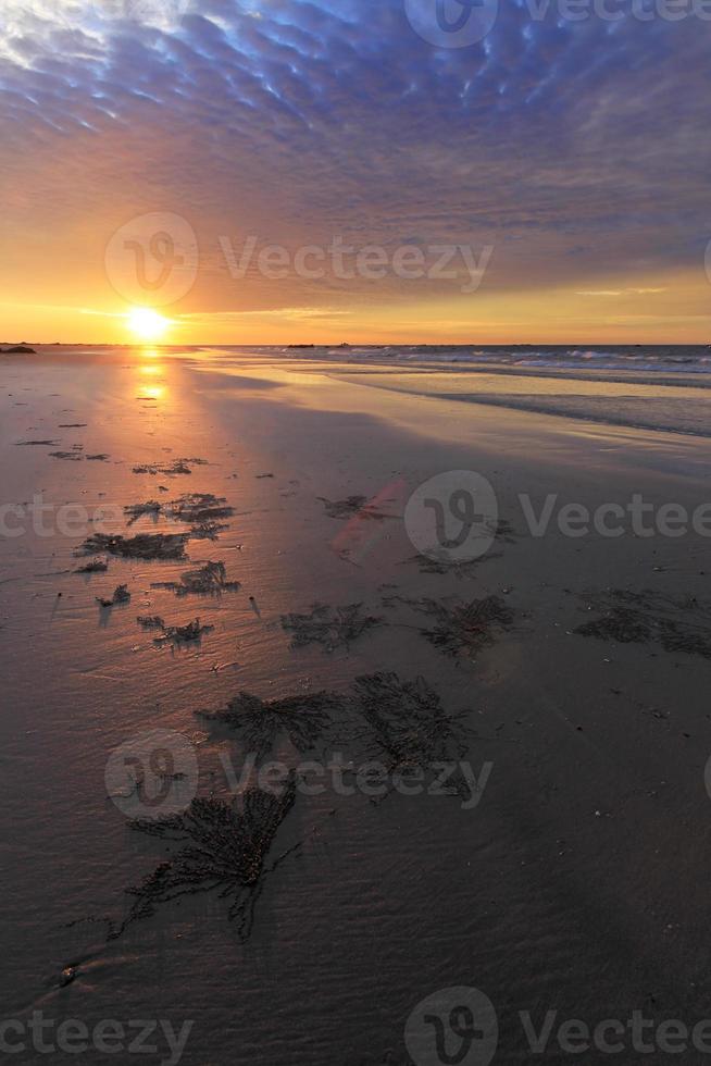 Sunset With Dramatic Clouds On A Beach Stock Photo Sunset With Dramatic Clouds On A Beach Stock Photo