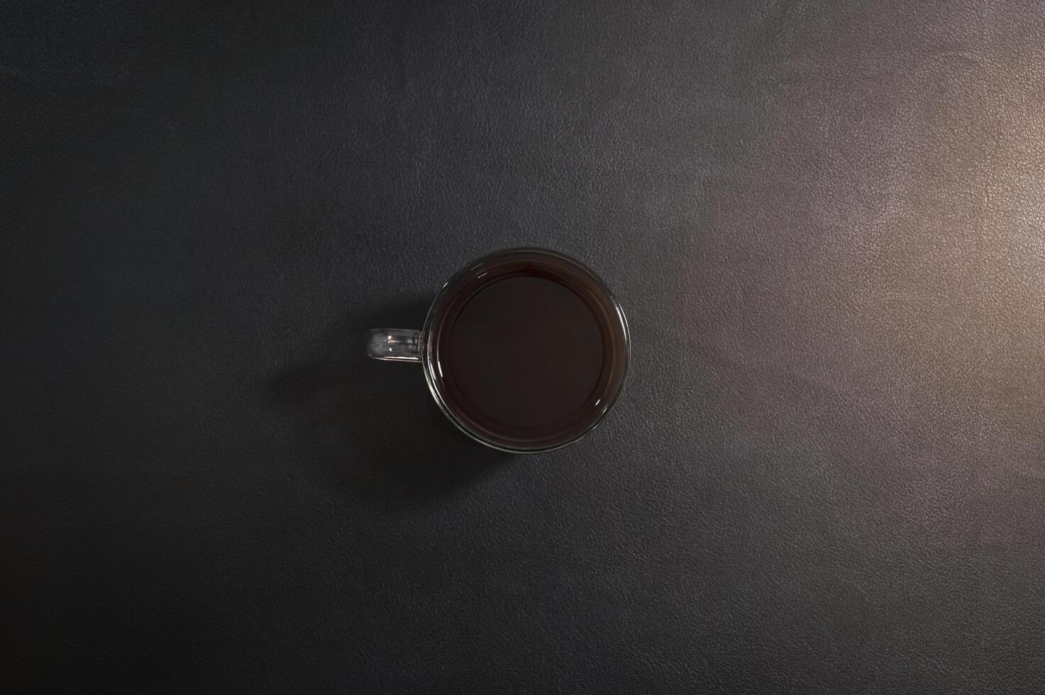 Cup of coffee on the desk photo