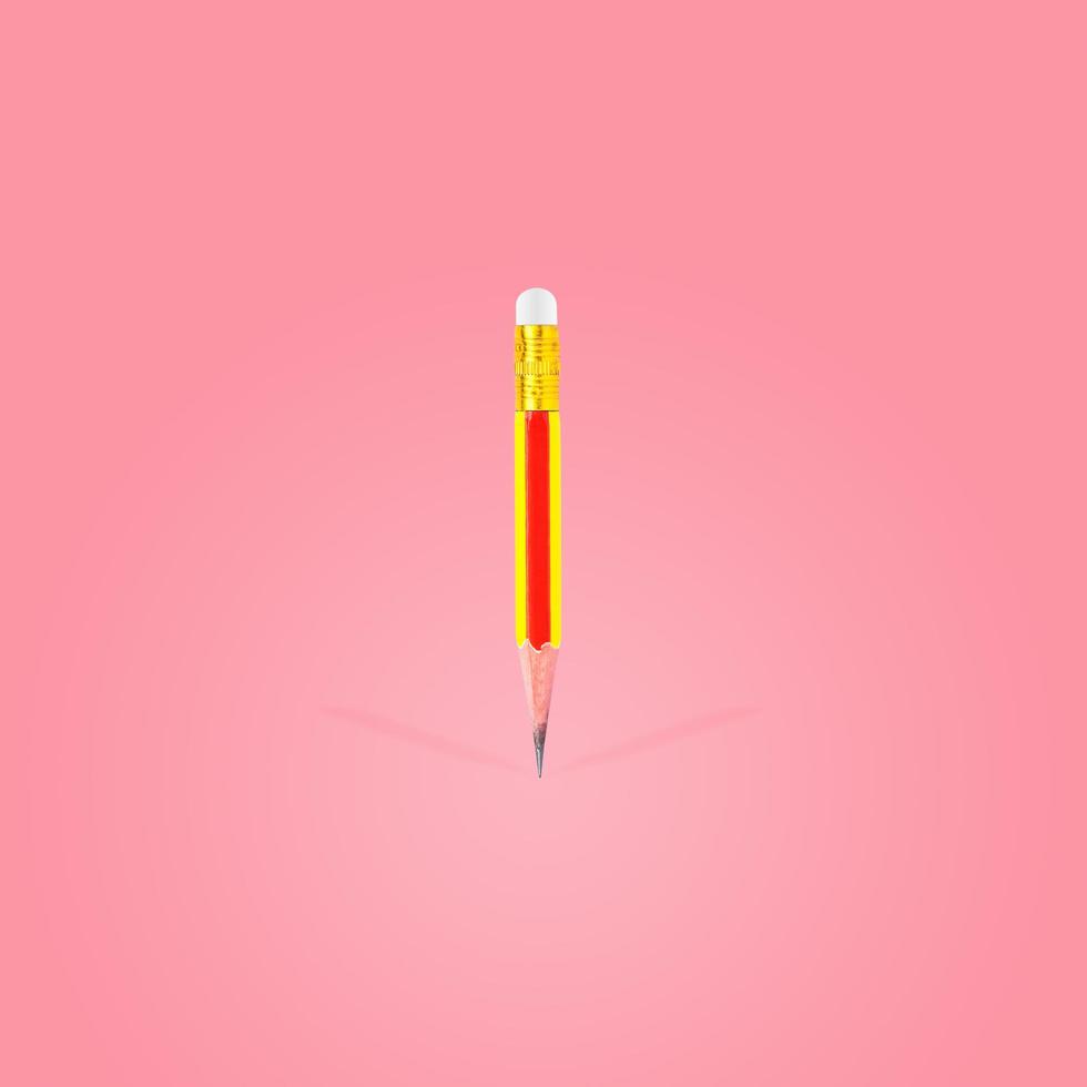 Short-sharpened wooden pencil and eraser photo