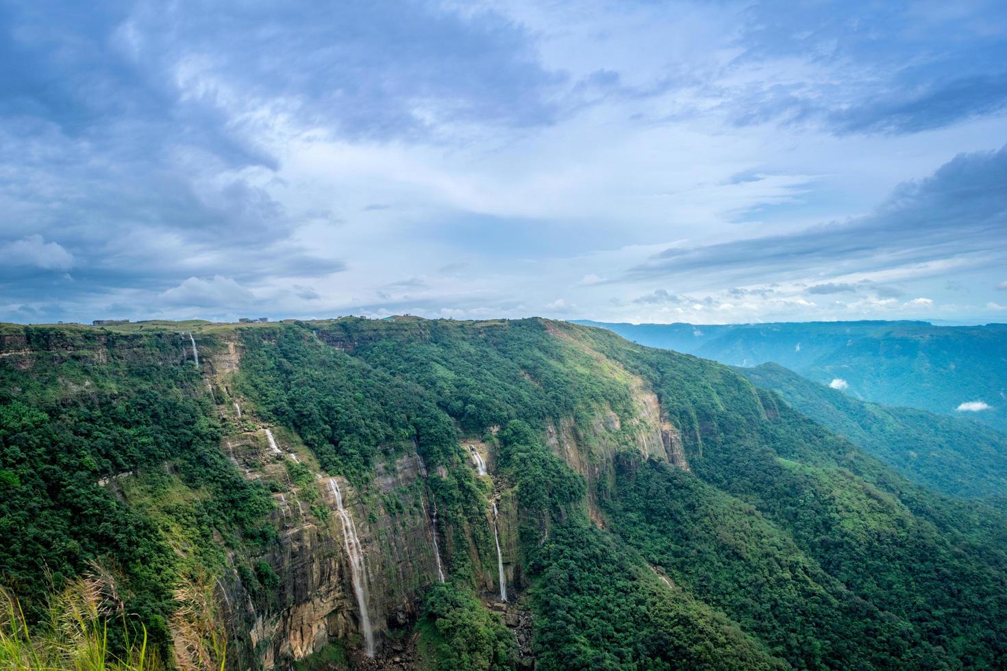 Cliffs with waterfalls in the mountains photo