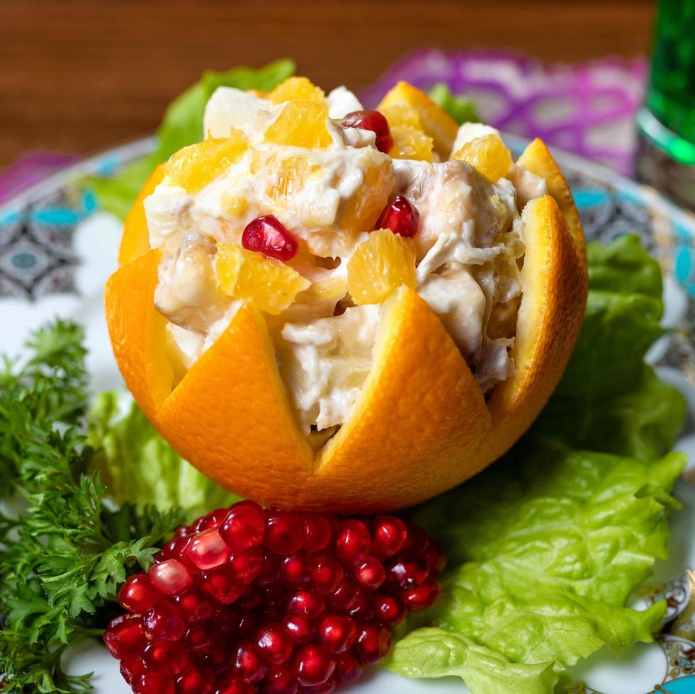 Orange appetizer with pomegranate photo