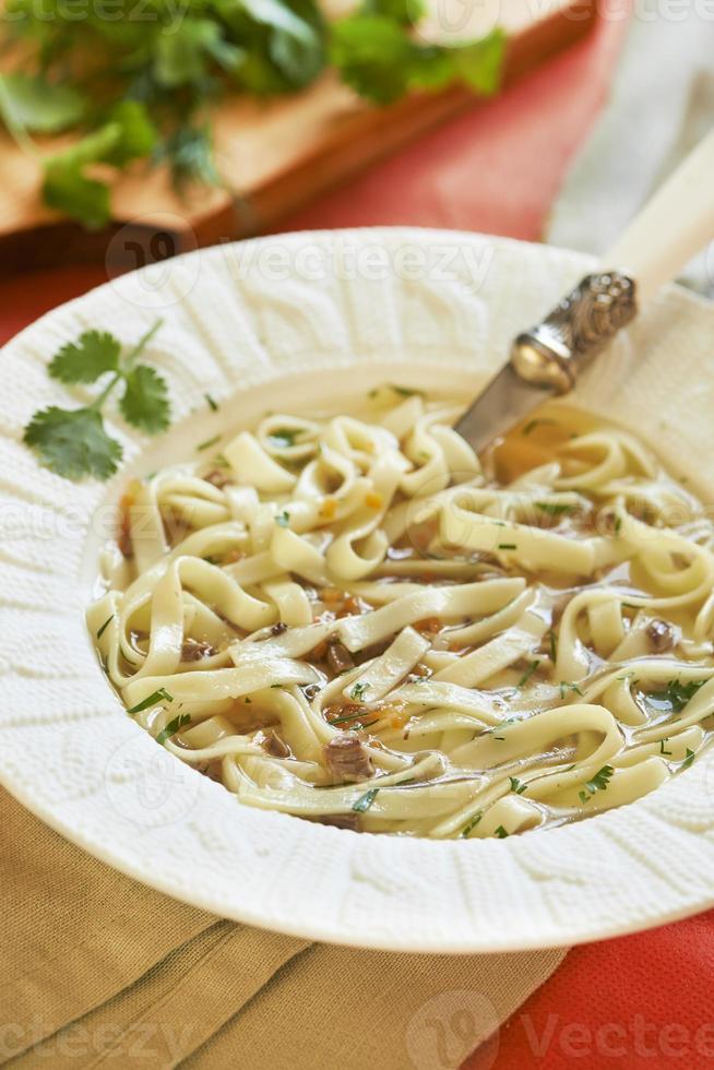 Noodle soup with turkey hearts photo
