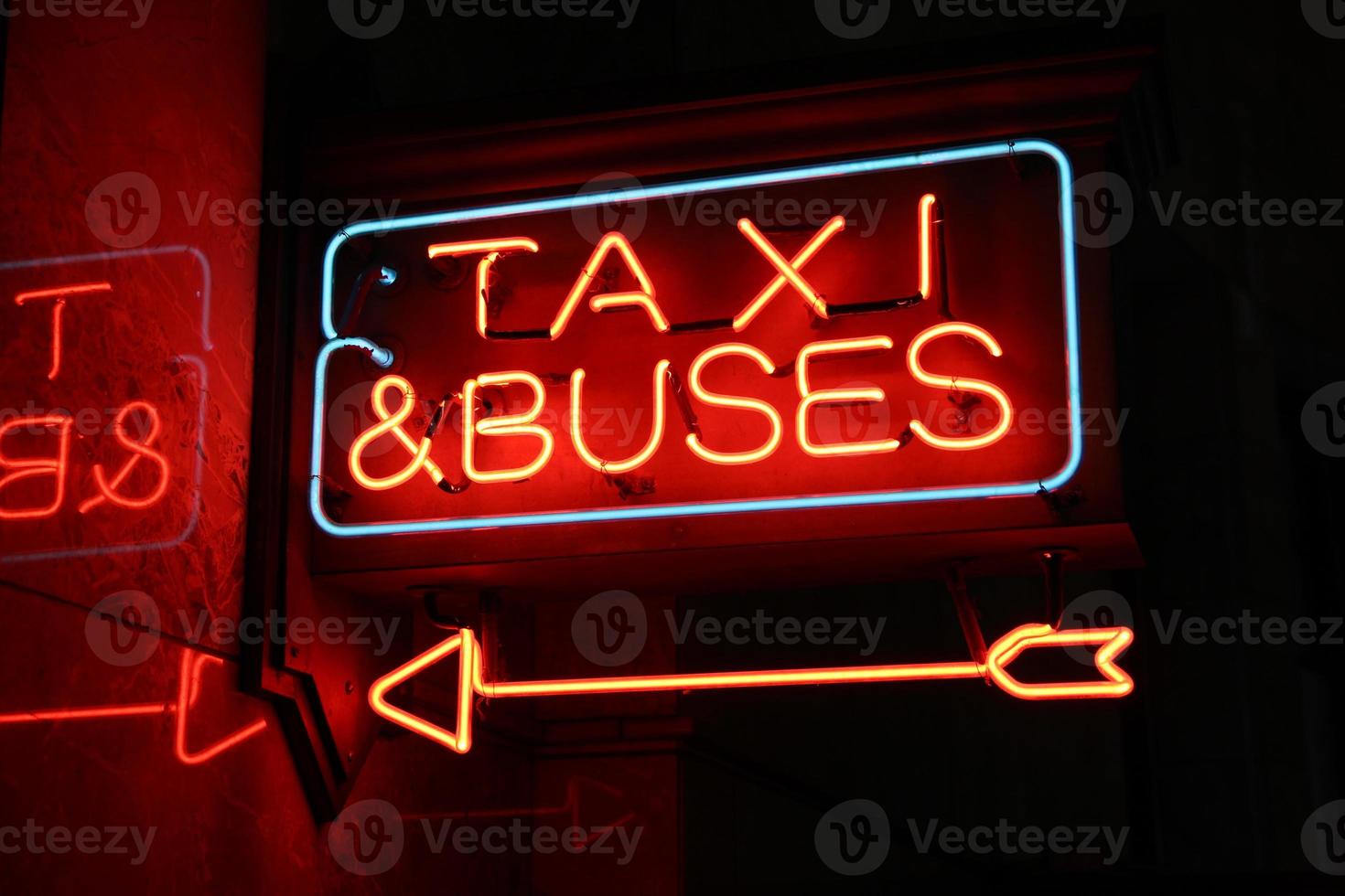 Neon Sign Taxi & Buses photo