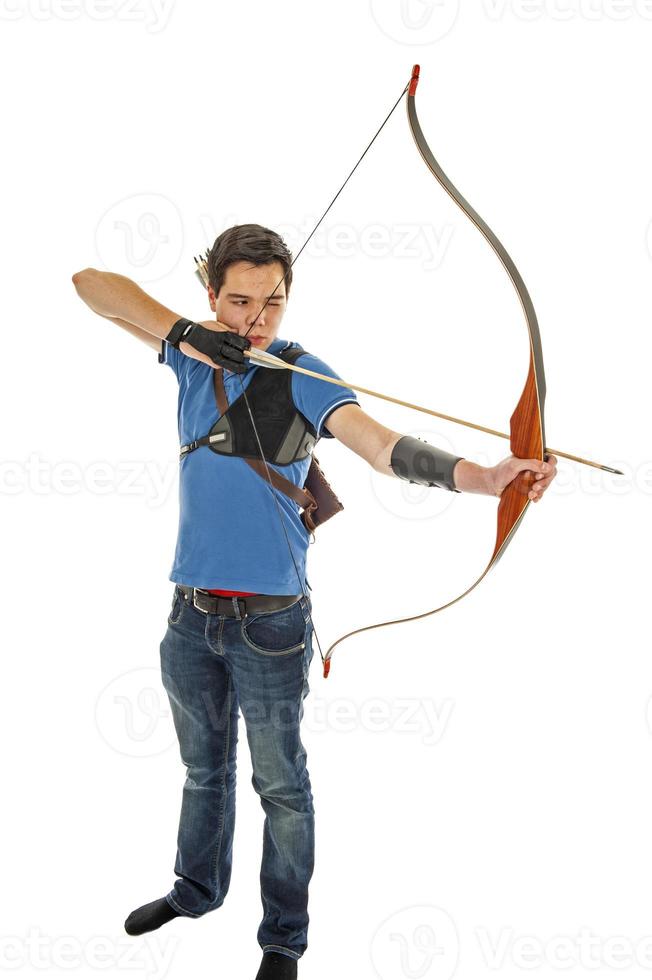 Boy shooting with bow and arrow 1366475 Stock Photo at Vecteezy