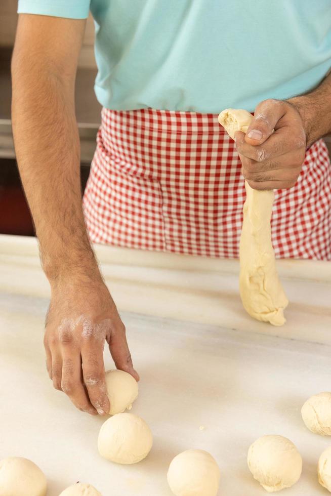 Chef rolling dough photo