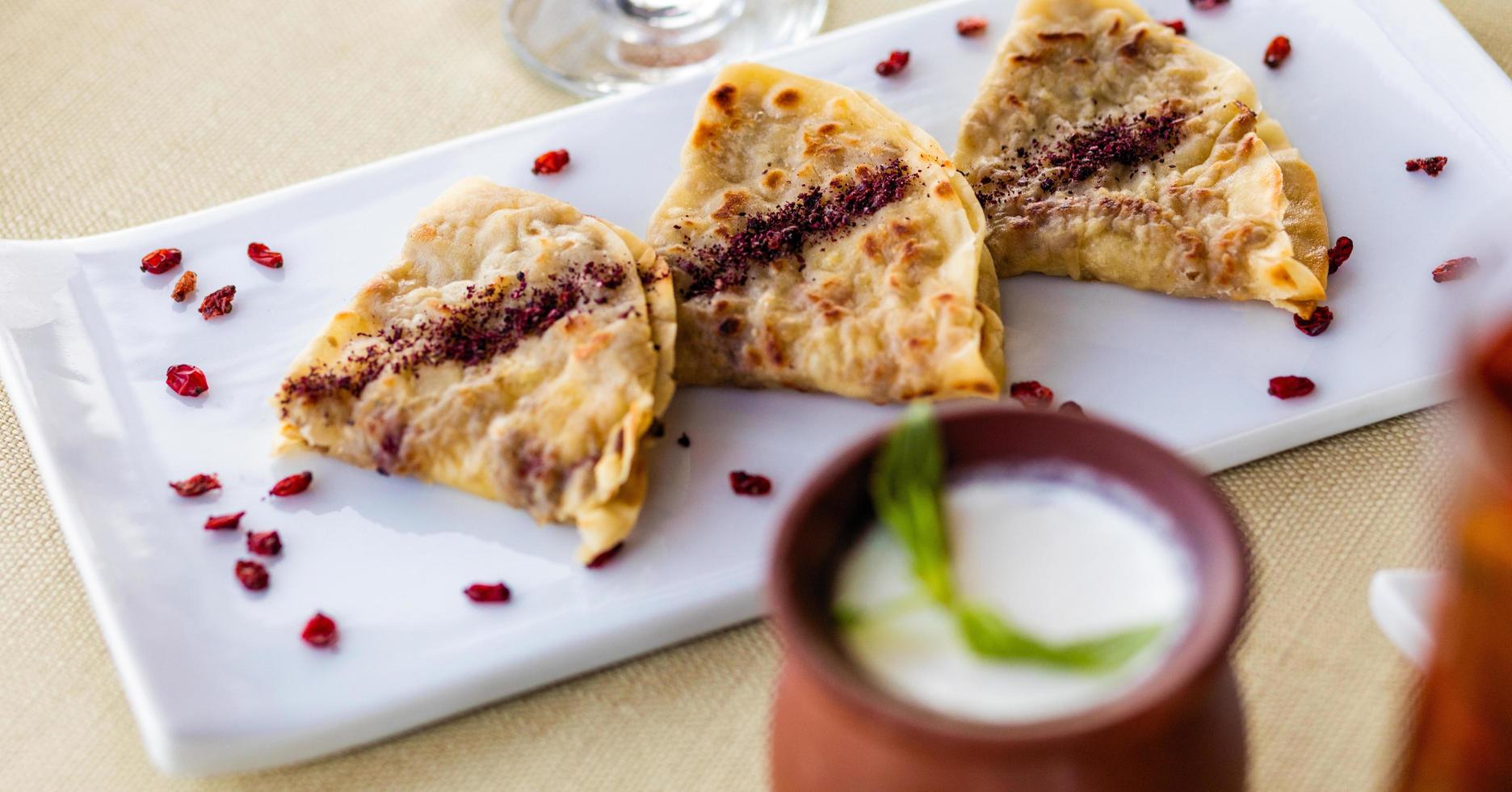 Tasty qutab, Azerbaijani meal with yogurt photo