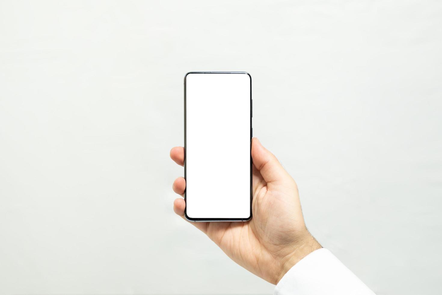 Holding a vertical white screen smartphone photo